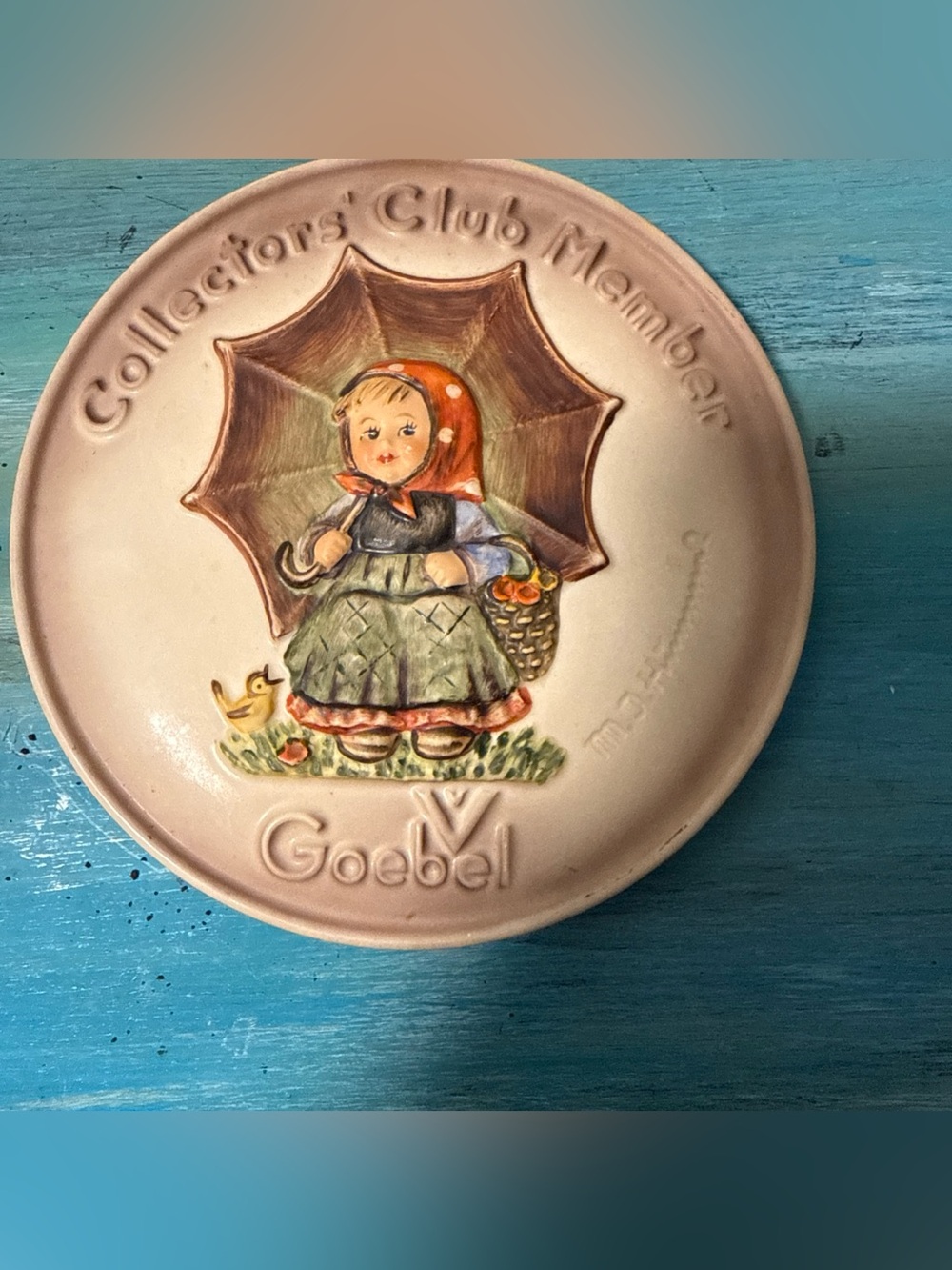 Goebel hand-painted plaque with green dress and pink skirt accents
